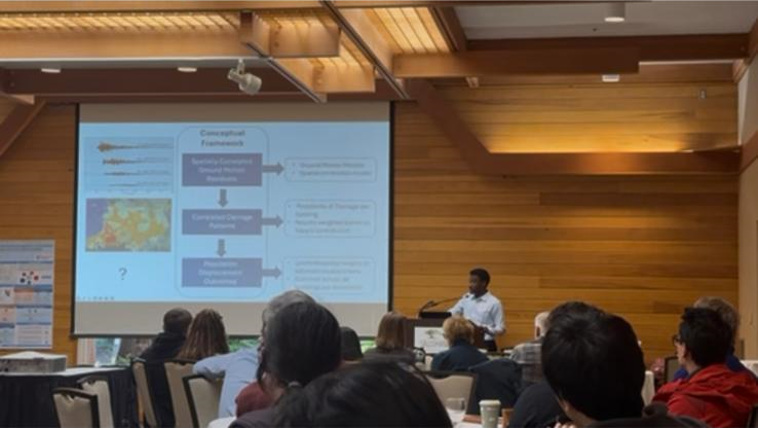 Emmanuel Randle presenting research on post-earthquake residential displacement