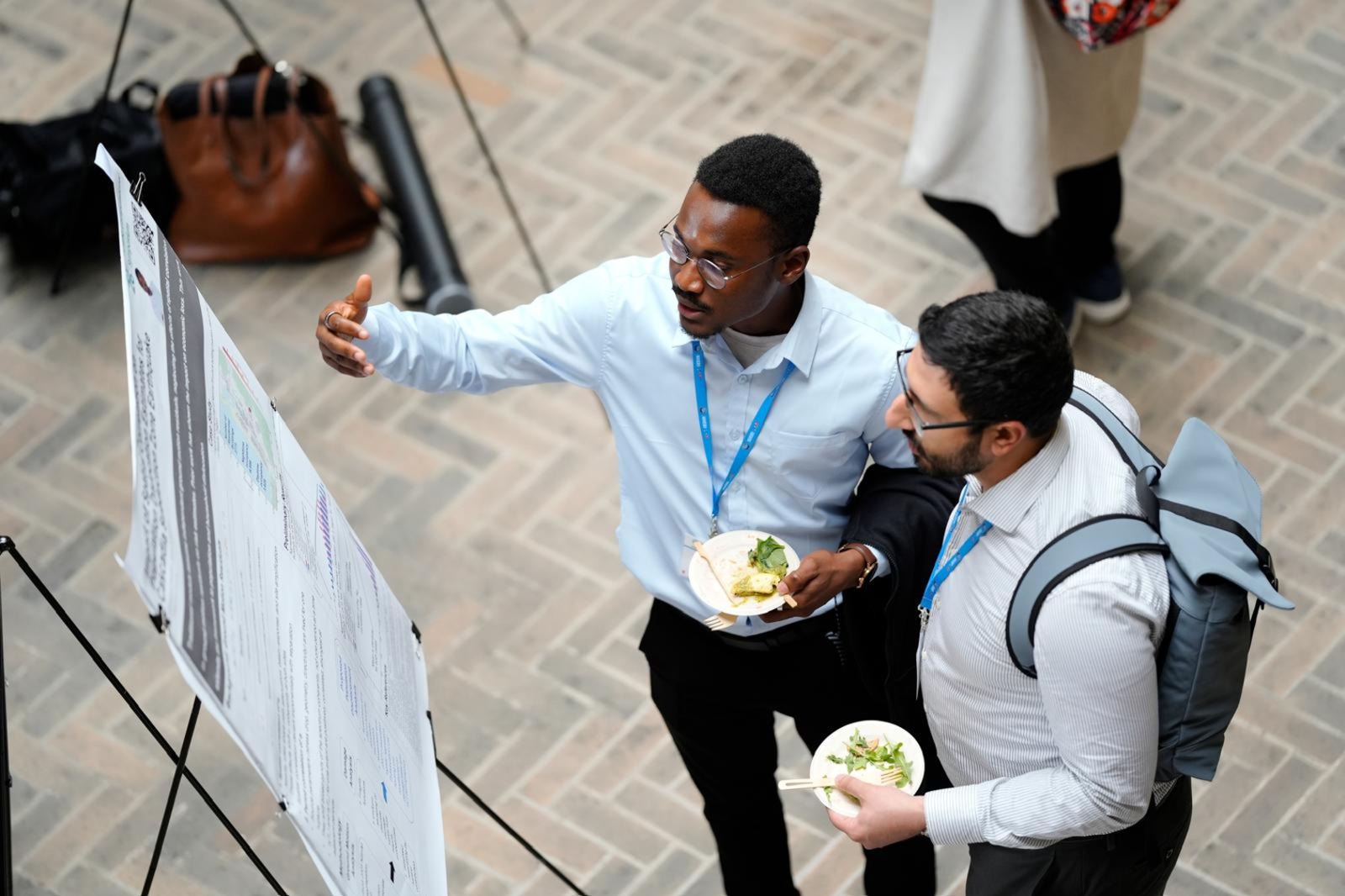Emmanuel Randle discussing his research poster at the 2026 NHERI Computational Symposium