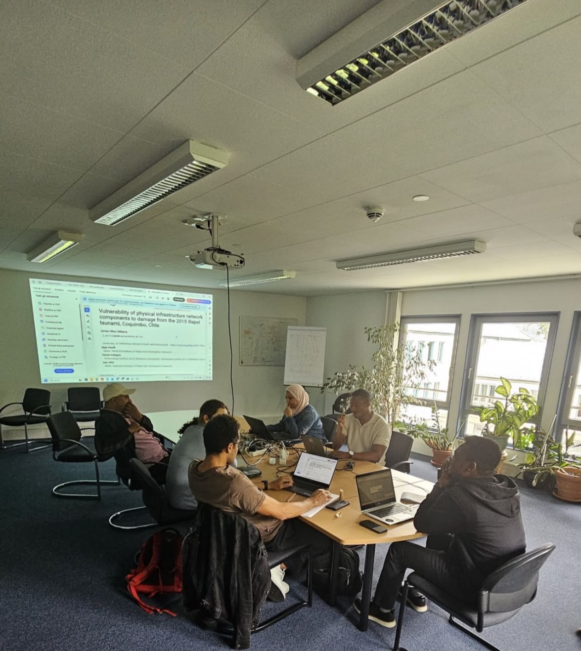 Emmanuel Randle and other participants working through a tsunami risk exercise at the PTRA workshop at GFZ in Potsdam
